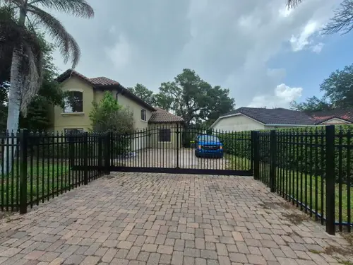 Aluminum fence with an electric driveway gate in Winter Park