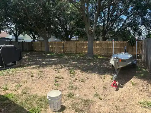 Wood board on board privacy fence around an Orlando backyard with a boat