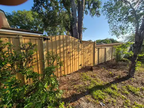Wood privacy fence with matching wood gate in Orlando